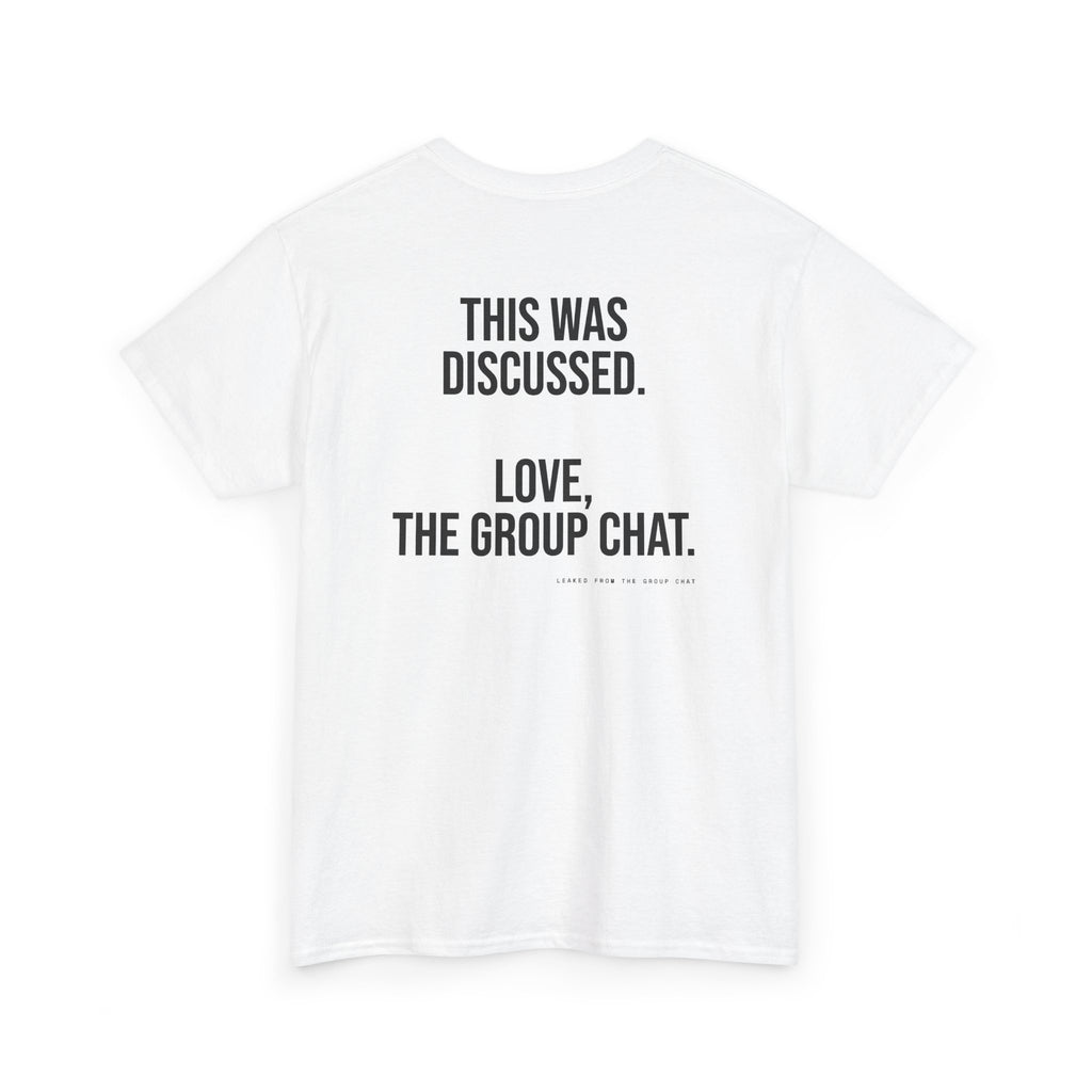 A white short-sleeve crewneck t-shirt with black printed text on the back reading 'THIS WAS DISCUSSED. LOVE, THE GROUP CHAT.'