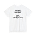 A white short-sleeve crewneck t-shirt with black printed text on the back reading 'THIS WAS DISCUSSED. LOVE, THE GROUP CHAT.'